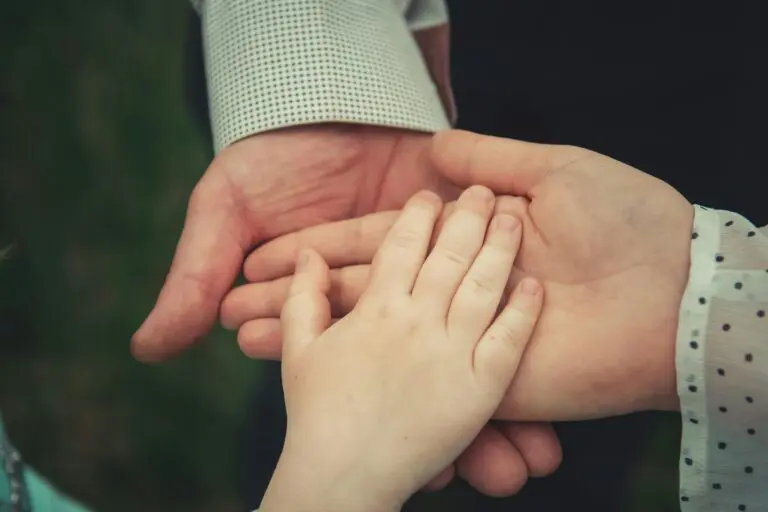 Family holding hands symbolising legacy planning and inheritance tax on pensions