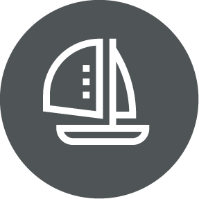 Icon of a sailboat, set in a dark gray circle.